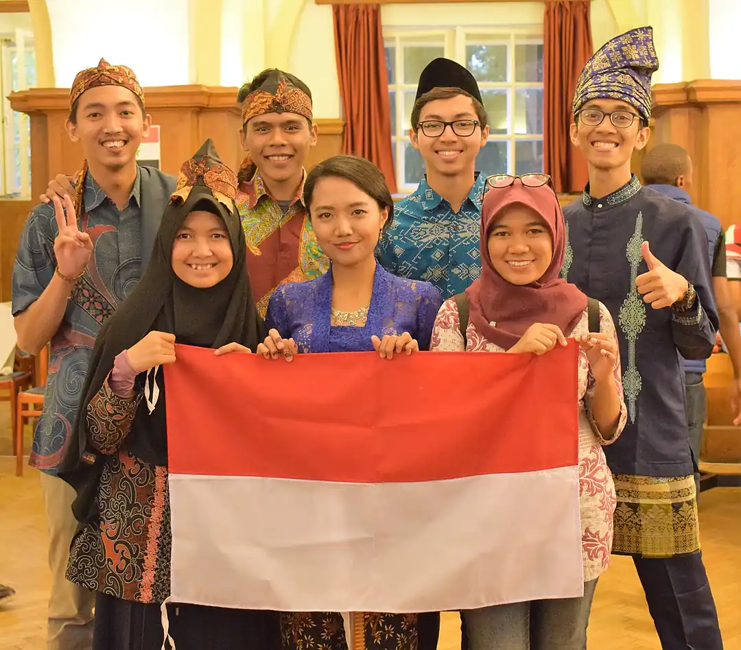 The Indonesian delegation holding the flag at Researchers Night